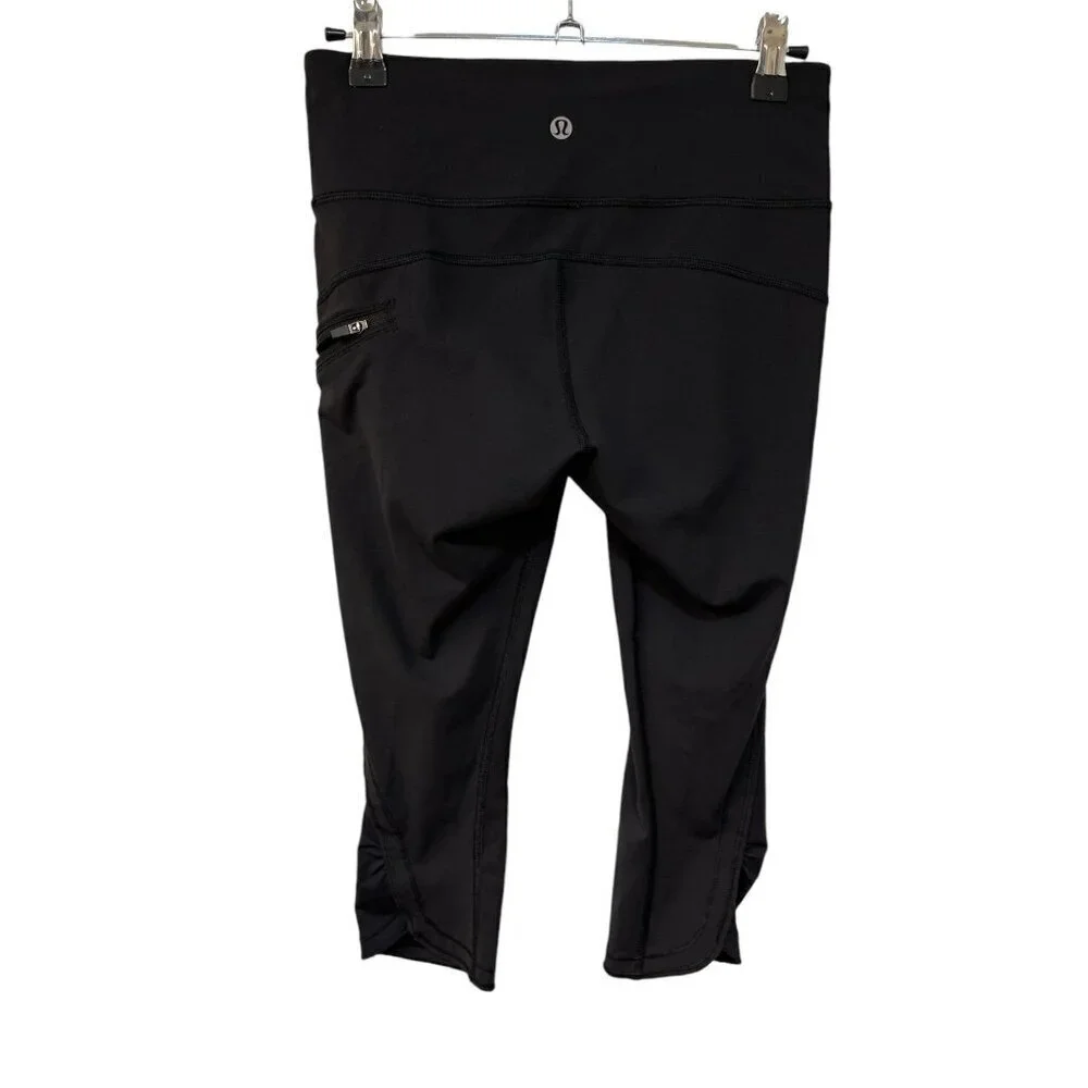 LULULEMON ATHLETICA BLACK SIDE ZIPPER POCKET CROP LEGGINGS SIZE 4 CAPRI